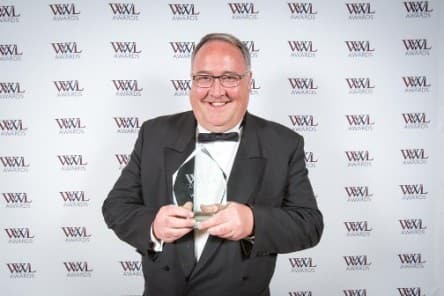 Jonathan Davey collecting his award at the 2016 Who's Who Legal Awards