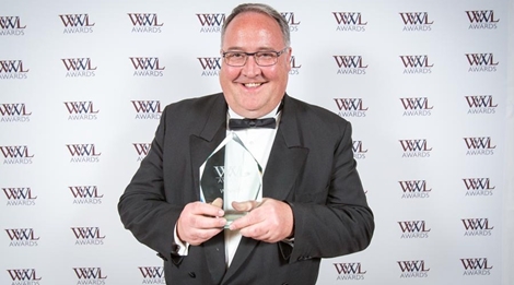 Jonathan Davey collects his award at the 2016 Who's Who Legal Awards