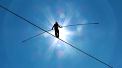 Risk management - man on tightrope