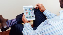 Man reading statistics Man reading statistics